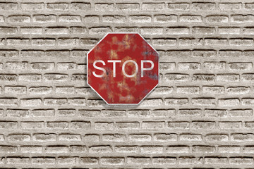 Stop traffic sign on brick three-dimensional wall
