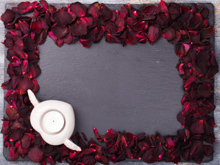 Background of red rose petals ,on a black background.Valentine's day.