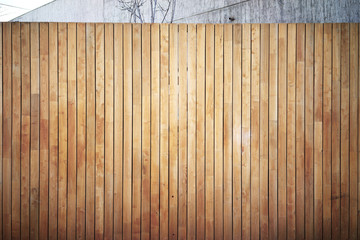 Highly detailed and empty wooden wall, outside. Gray wall on the background.