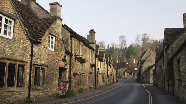 Street in-between old stone buildings in England.