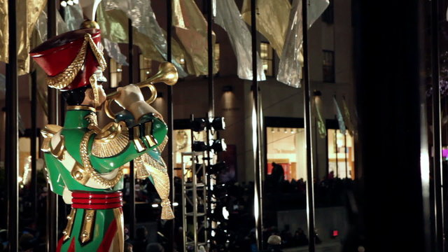 Statue of a guy with a trumpet during Christmas in New York.