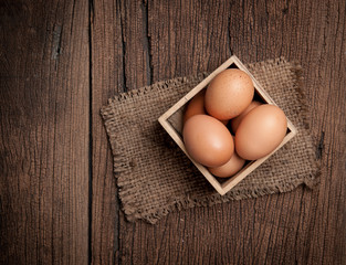Eggs on wooden table background