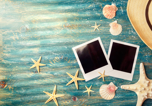 Blank polaroid pictures with sea shells
