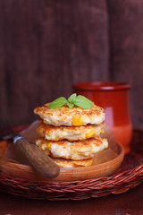 Corn fritters on a dark wooden background