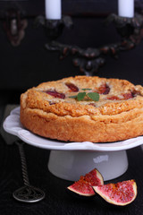 cake stuffed with almond and fig in a white plate