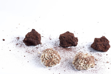 dark chocolate truffles with cocoa powder, biscuits and chopped