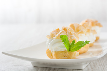 Fresh profiteroles with cream
