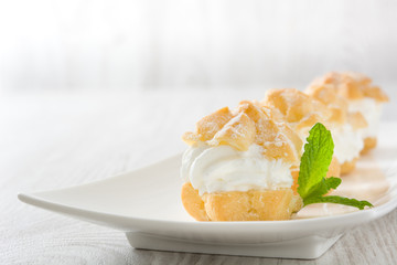 Fresh profiteroles with cream
