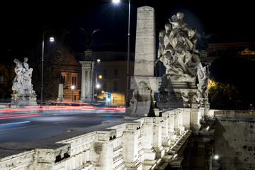 Fototapeta na wymiar Image of a statue of Victor Emmanuel II bridge with winged victories travertine. Rome at night in black and nero.Italy