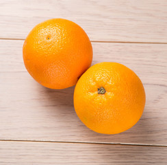 Orange fruits on wooden table background