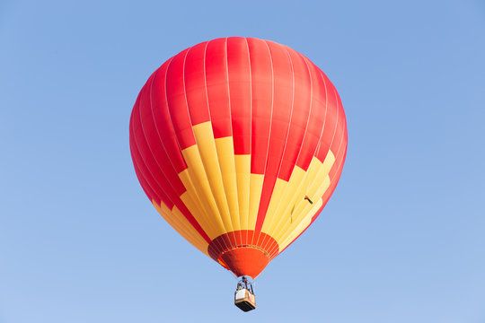 Colorful hot air balloon on blue sky background