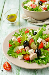 Fresh salad with tuna, tomatoes and cucumbers