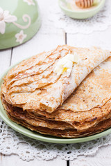 Stack of pancakes with honey and butter.Carnival,a traditional Russian holiday.selective focus.