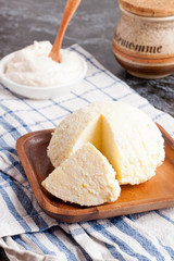 Cheese on a wooden plate