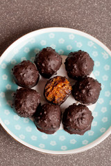 handmade raw chocolate candy with nuts, figs and citrus, truffle