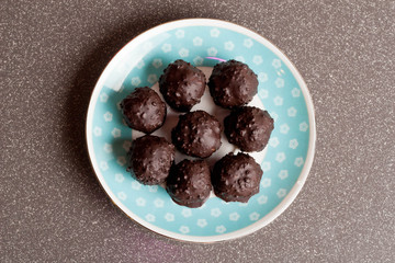 Raw chocolate candy with nuts, figs and citrus, truffle, healthy