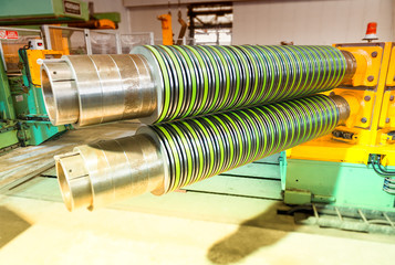 Metal coils machine. Interior of factory. Business concept