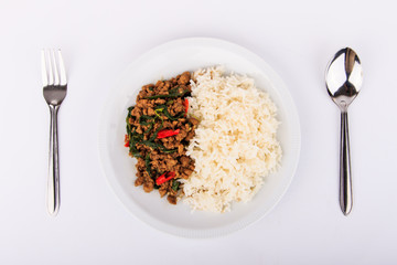 Rice topped with stir-fried pork and basil, fried stir basil with  minced pork on white background (isolated background)