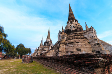 Fototapeta premium Asian religious architecture. Ancient Buddhist pagoda ruins at Wat Phra Sri Sanphet Temple in Ayutthaya, Thailand 