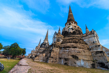 Fototapeta premium Asian religious architecture. Ancient Buddhist pagoda ruins at Wat Phra Sri Sanphet Temple in Ayutthaya, Thailand 