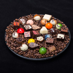 Set of a various chocolate pralines and coffee beans