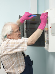 Man fixing electric light meter