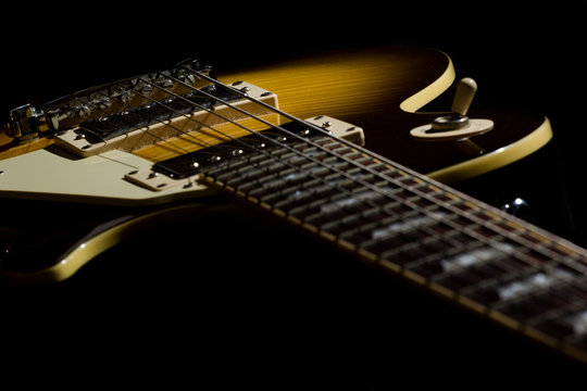 Electric guitar isolated on a black background