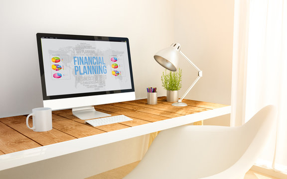 minimalist workplace with financial planning computer