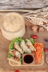 Fried gyoza and sauces - traditional Japanese food.