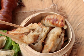 Fried gyoza and sauces - traditional Japanese food.