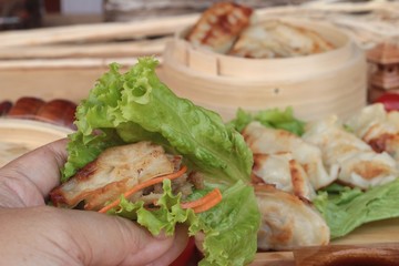 Fried gyoza and sauces - traditional Japanese food.