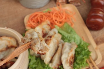 Fried gyoza and sauces - traditional Japanese food.