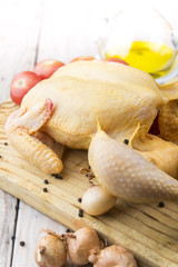 Raw chicken on wooden table