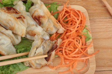 Fried gyoza and sauces - traditional Japanese food.