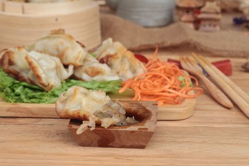 Fried gyoza and sauces - traditional Japanese food.