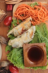 Fried gyoza and sauces - traditional Japanese food.