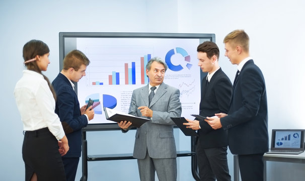 successful business man, conducting presentations to partners