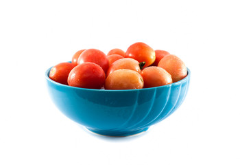 small tomatoes in blue bowl