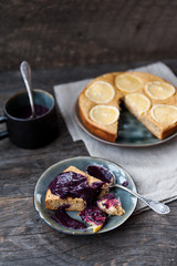 Lemon tart with blueberry sauce