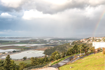 winter view of landscape with rainbow 