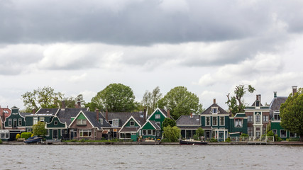 Fototapeta na wymiar Traditional Dutch Houses in a Neighborhood of Zaanse Schans, Netherlands