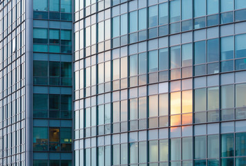 Sunset reflections in skyscraper wall