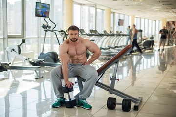 Strong bearded man in gym.