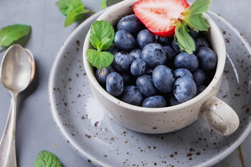 Strawberries and Blueberries on metal background