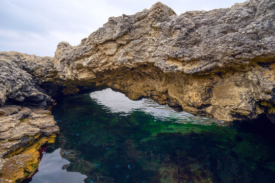  large boulder overhanging the water