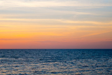 Sea and sky at sunset .