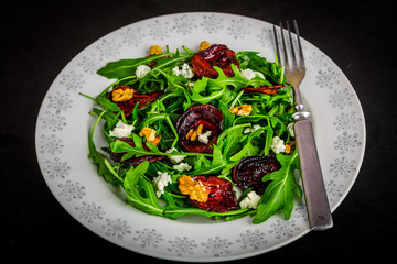 Raw green beet and arugula salad with blue cheese