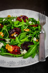 Raw green beet and arugula salad with blue cheese