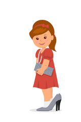 Beautiful little girl in high-heeled shoes.