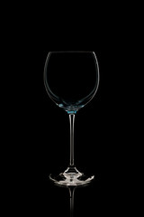 elegant wine glass isolated on a black background